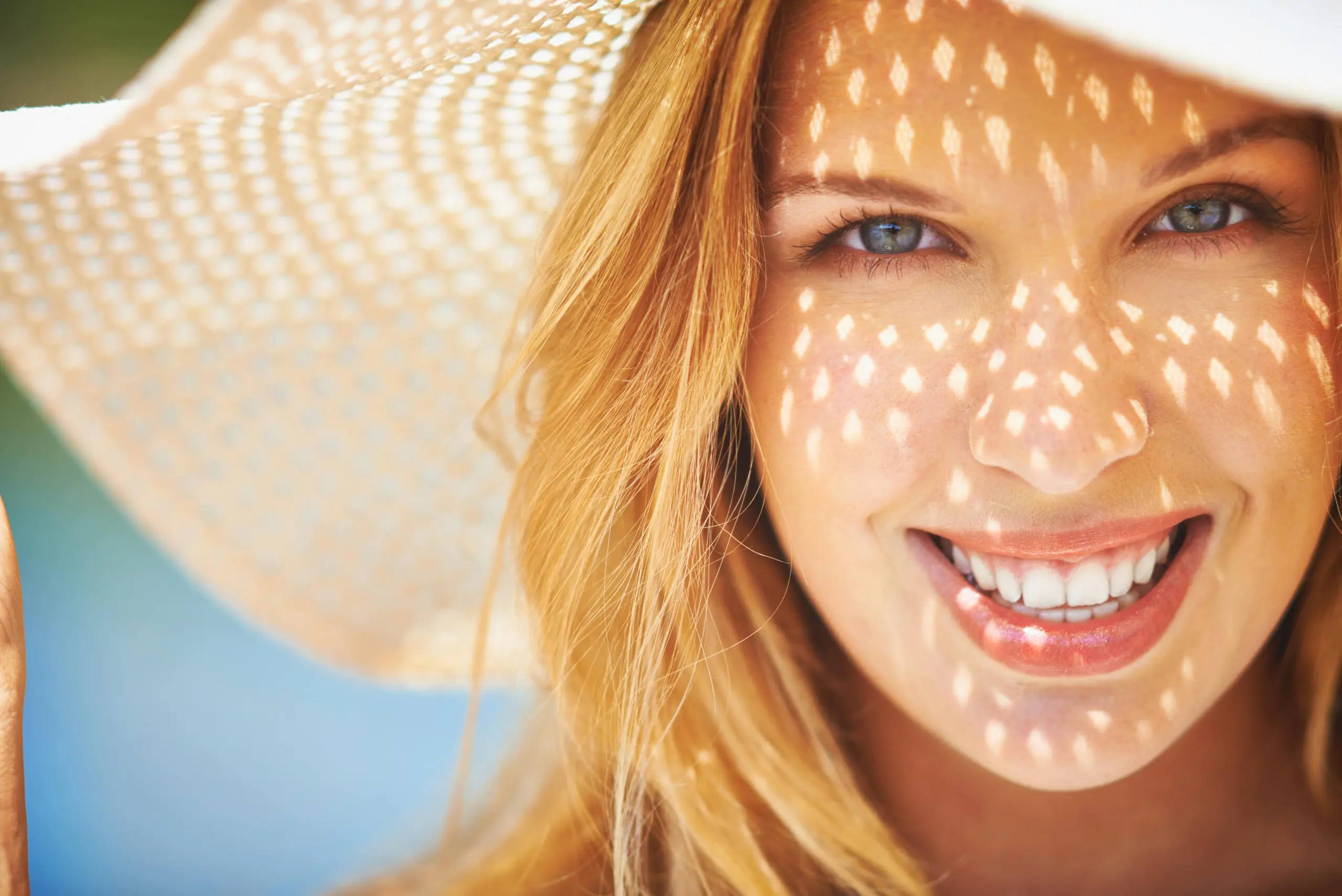 woman with big smile close up min scaled